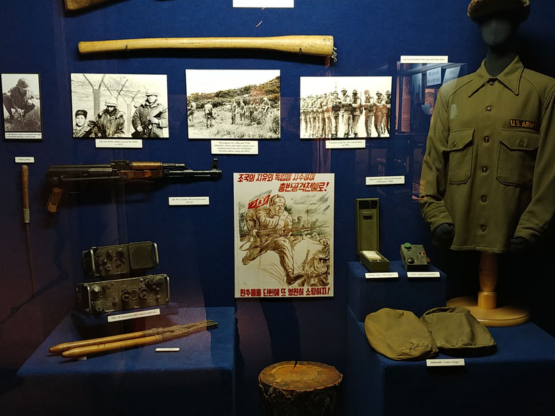 Museum artifacts in glass enclosure at the 2nd Infantry Division Museum.